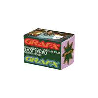 A box of Grafx 35mm Graphic Overlay Film Shattered Series #35003, featuring a green front panel with red, yellow, and blue Grafx logos, a pink side panel with a green star logo, and a top lid showing a preview of the shattered graphic effect.