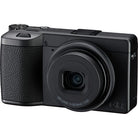Black camera with a prominent lens on a white background