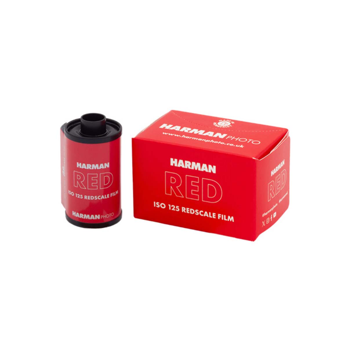 A red Harman Red ISO 125 Redscale Film roll standing next to its matching red packaging box on a clean white background.