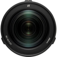 A close-up studio shot of a black camera lens with white text indicating '2.8-35mm' and 'Ø65mm', along with a stylized 'H' logo at the top, set against a plain white background.