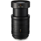 Black camera lens with focus scale on a white background