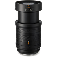 Black camera lens with focus scale on a white background