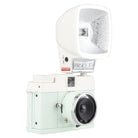 A vintage-style camera in a pale mint green color, equipped with a white flash unit and a silver lens, shown against a plain white background.