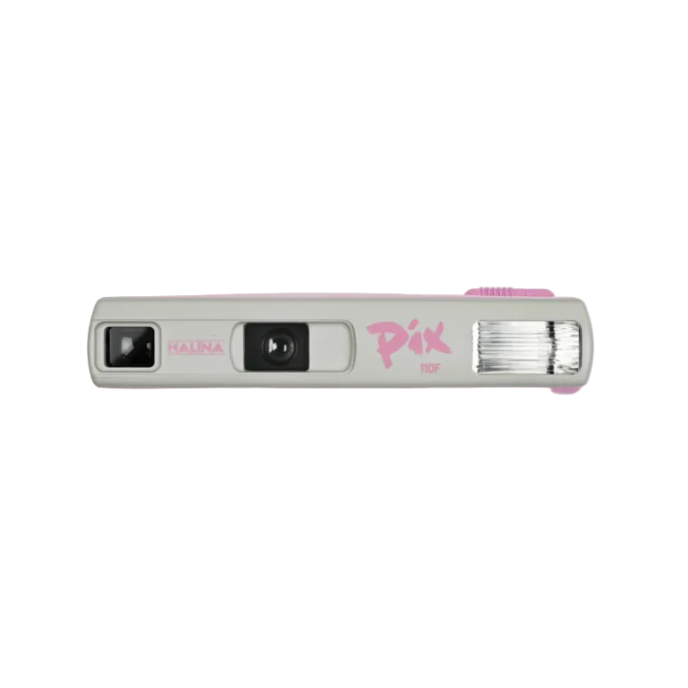 Halina Pix 110F Camera, a compact film camera with a pink and silver color scheme, featuring a flash unit on the top, a lens on the front, and manual winding mechanism.