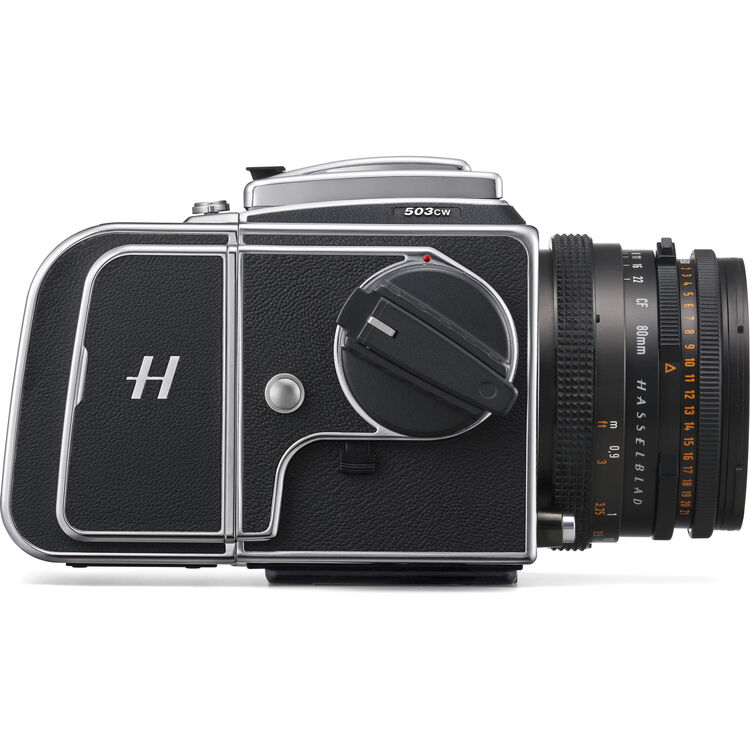 A black and silver Hasselblad 500Cw medium format camera with an attached black lens, shown from a side profile on a white background.