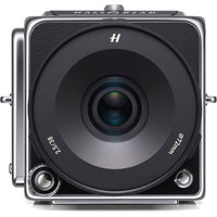 A Hasselblad medium format camera shown from the front, featuring a large black lens with white text and a silver-toned metal body, isolated on a white background.