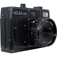 Black Holga 135FC toy camera with a glittery finish, built-in flash, and a 47mm optical lens on a white background.