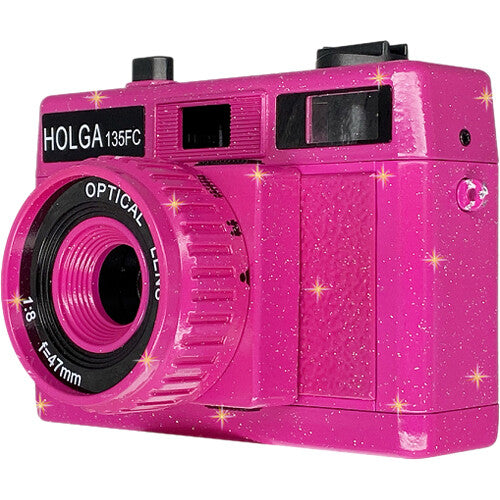 Sparkling hot pink Holga 135FC toy camera with a 47mm optical lens and built-in flash against a white background.