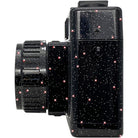 Side view of a black Holga 135FC toy camera featuring a glossy finish with a sparkling, star-like glitter pattern.