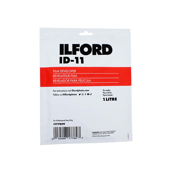 A 1 litre package of Ilford ID-11 Film Developer developer solution, featuring a white and red plastic pouch with black text and a barcode.