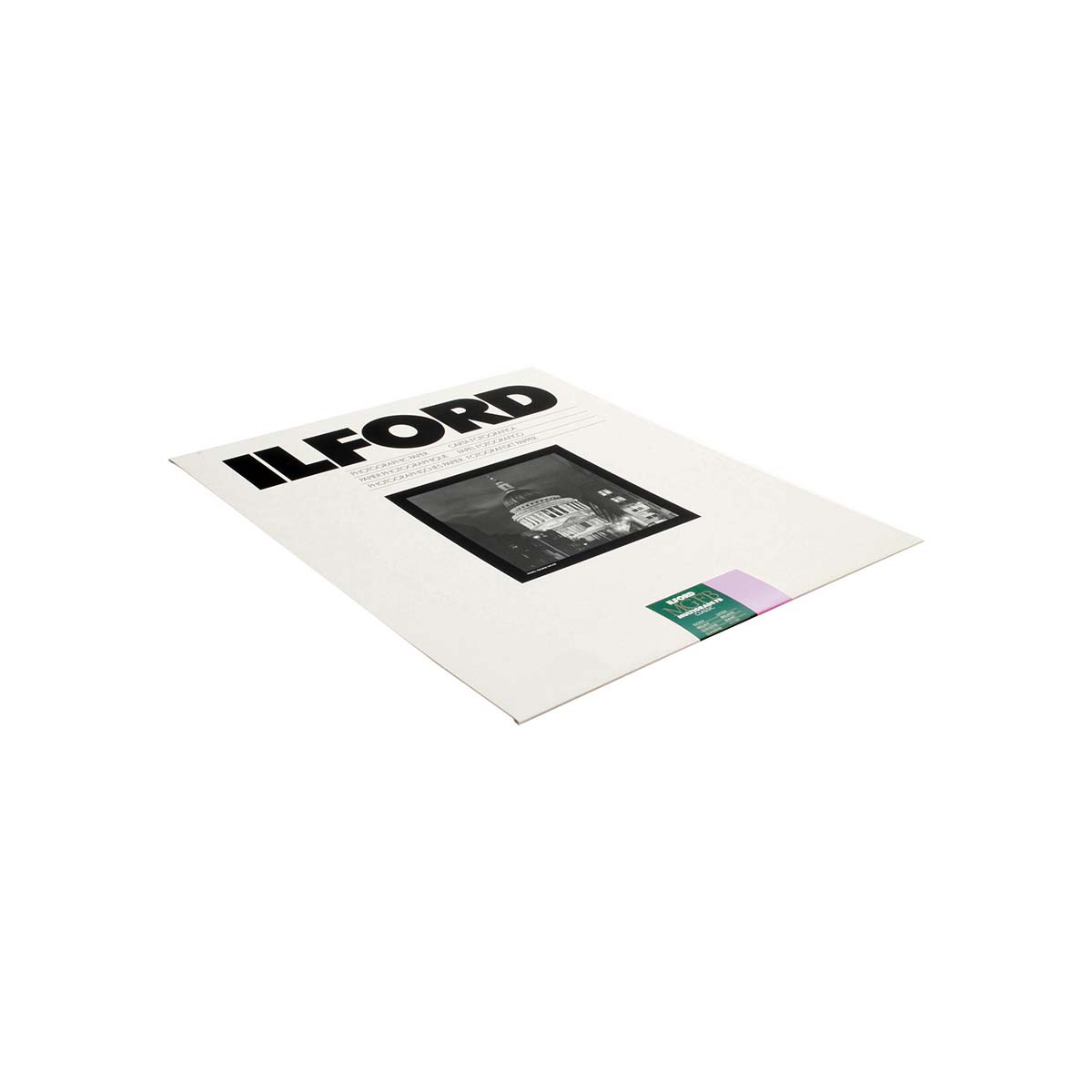 Ilford-Multigrade-FB-Classic-Paper-Glossy-10-Sheets-1 a black-and-white photograph in the center, and a small green and lavender label near the bottom right, shown on a plain white background.