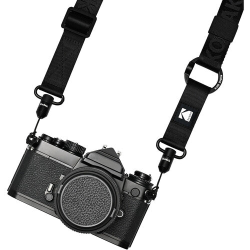 Black camera with a strap on a white background