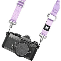 Camera with a purple strap on a white background