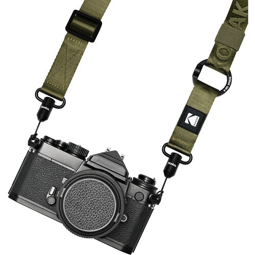 Camera with a green strap on a white background