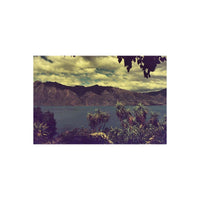 Landscape shot of mountains and a lake with pink-tinted, candy-like color shifts from KONO! Candy 200 35mm film.