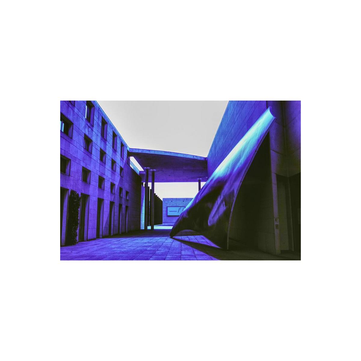 Modern architecture courtyard captured on KONO! Donau II film with distinct blue and purple color shifts.