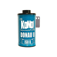 KONO! Donau II ISO 8 35mm film roll in a blue canister with white branding and a protruding film leader.