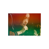 Portrait shot with KONO! Galaxy 200 film featuring vibrant red and green light leaks over a woman's face.