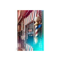 Barber shop exterior shot on KONO! Galaxy 200 film with vibrant blue light leaks and experimental color shifts.
