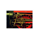 Close-up of a red steam locomotive wheel with brass mechanical linkages, captured on KONO! Moonstruck 200 color film.