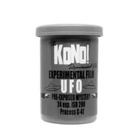 A gray plastic film canister labeled KONO! EXPERIMENTAL FILM UFO with text indicating it is pre-exposed mystery 24 exp. ISO 200, Process C-41.