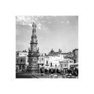 Black and white square-format shot of an ornate stone monument in an Italian town square, captured on Kentmere Pan 100 film.