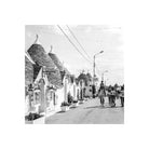 Black and white street scene featuring traditional conical trulli houses in Alberobello, captured on Kentmere Pan 400 film.