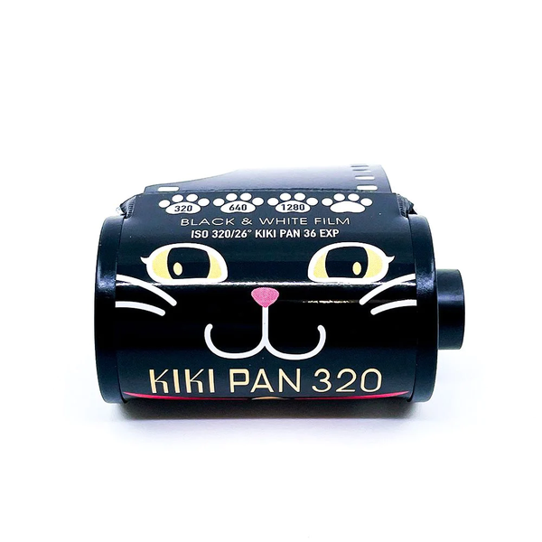 Black cat face illustration on a black 35mm film canister with KIKI PAN 320 words on a white background