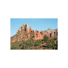 Vivid landscape of red rock formations under a clear blue sky, captured with sharp detail on Kodak Ektar 100 film.