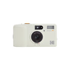 A Kodak Snap! II disposable camera in a cream color with a black lens and orange 'Snap! II' text, shown against a plain white background.
