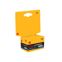 Kodak Ultramax 400 color negative film roll in its original yellow retail packaging, featuring a hanger tab and a box with black and blue text accents.