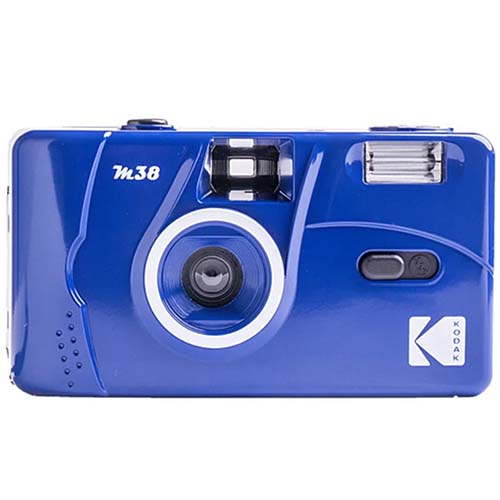 Glossy blue Kodak M38 35mm film camera with a fixed-focus lens, built-in flash, and white branding on a lightweight plastic body.