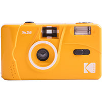 Bright yellow Kodak M38 35mm reusable film camera with a built-in flash and compact plastic body design.