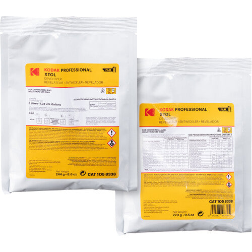 Two white Kodak Professional XTOL film processing pouches with yellow labels, shown on a plain white background. One pouch is front-facing and the other is angled to show the back label.