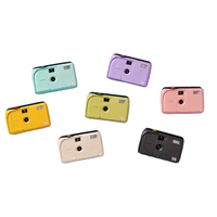 Six retro-style instant cameras in pastel and neutral colors, including mint green, yellow, lavender, pink, cream, and black, arranged on a split light blue and lavender background.