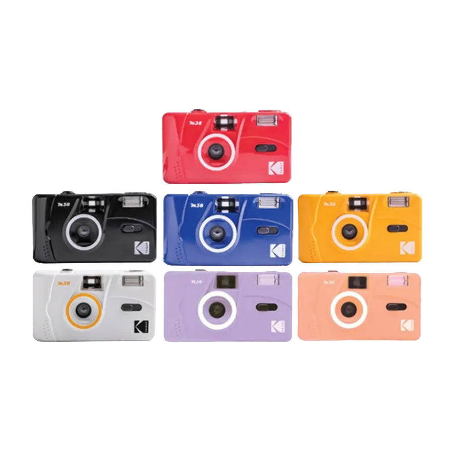 Six Kodak Mini-LTR compact cameras arranged in a 3-by-2 grid on a plain white background, shown in red, black, blue, yellow, white, and lavender.