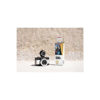 LomoChrome Color '92 110 film box next to a compact 110 film camera on a textured stone surface.