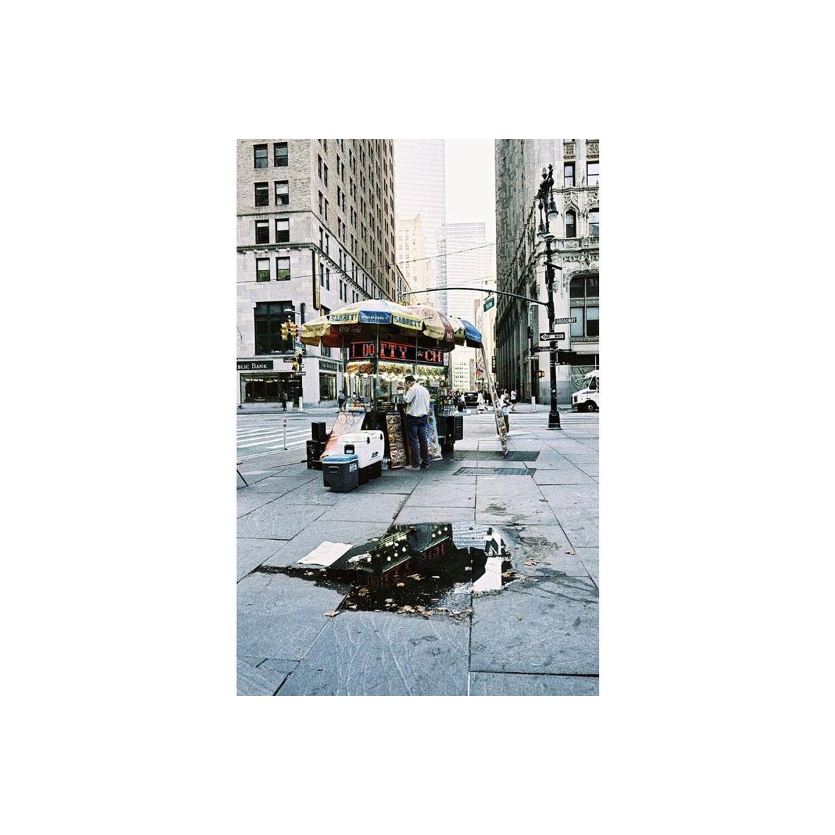 Street scene in New York City with muted tones, high contrast, and gritty grain captured on LomoChrome Metropolis 120 film.