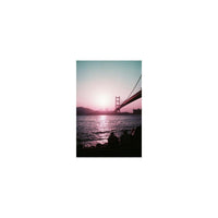 Golden Gate Bridge silhouette captured on 35mm film with dreamy purple, plum, and red color shifts.