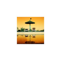 Poolside setting with a thatched umbrella and chairs on a yellow-orange gradient background