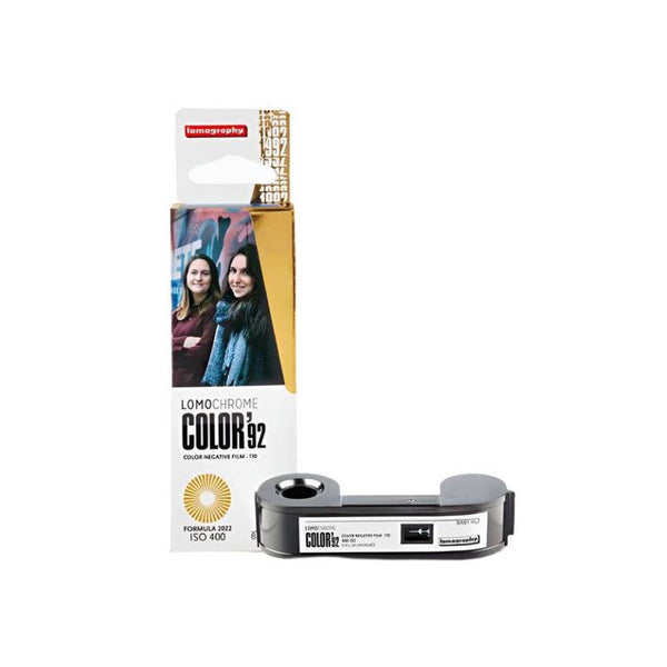 A LomoChroma Color 32 film developer cartridge shown next to its retail packaging on a plain white background.