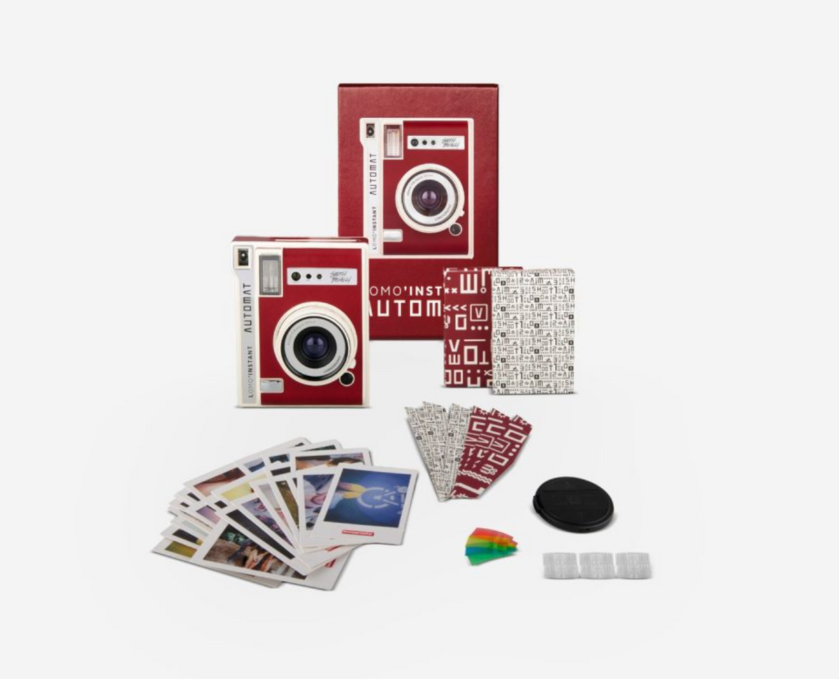 Lomo’Instant Automat Camera South Beach Edition with red and white color theme, including the camera, flash, film pack, and other accessories.