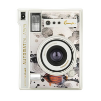 A Loinglass Ema instant camera with a white and black ink-wash floral pattern, featuring gold lettering and a small orange fish illustration near the bottom.
