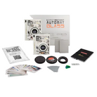 Lomo Instant Automat Glass film camera kit with accessories including a camera body, lens, filters, card holder, and instruction booklet on a white background.