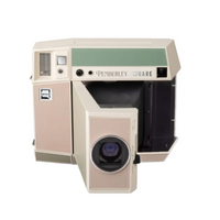 A vintage Pembrokley Quare medical imaging device, likely a radiograph or fluoroscopy unit, shown against a plain white background. The machine has a beige and sage green color scheme with a prominent front-facing lens and an open side compartment.