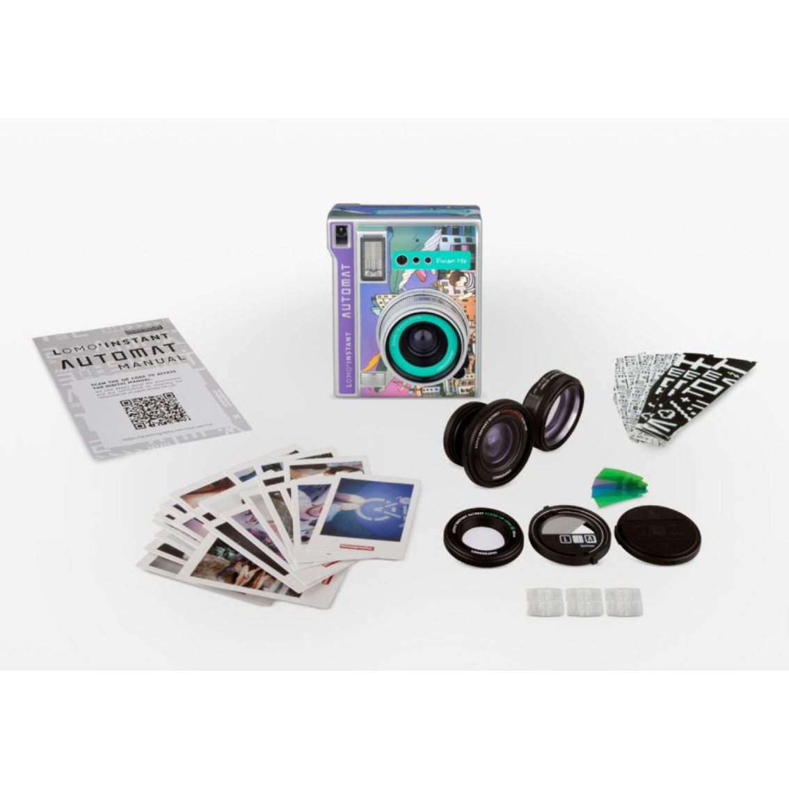 Lomo’Instant Automat Camera and Lenses Vivian Ho Edition with various lens attachments, flash, and a pack of Fujifilm Instax Mini film.