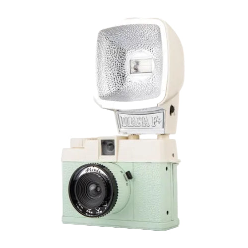 A vintage-style camera with a large attached flash unit, featuring a mint green textured body, cream plastic sections, and a black lens. The flash head has a silver diffuser and a visible 'MAYA F' plate.