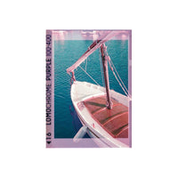 Sailboat on water with Lomochrome Purple 100-400 film effect overlay
