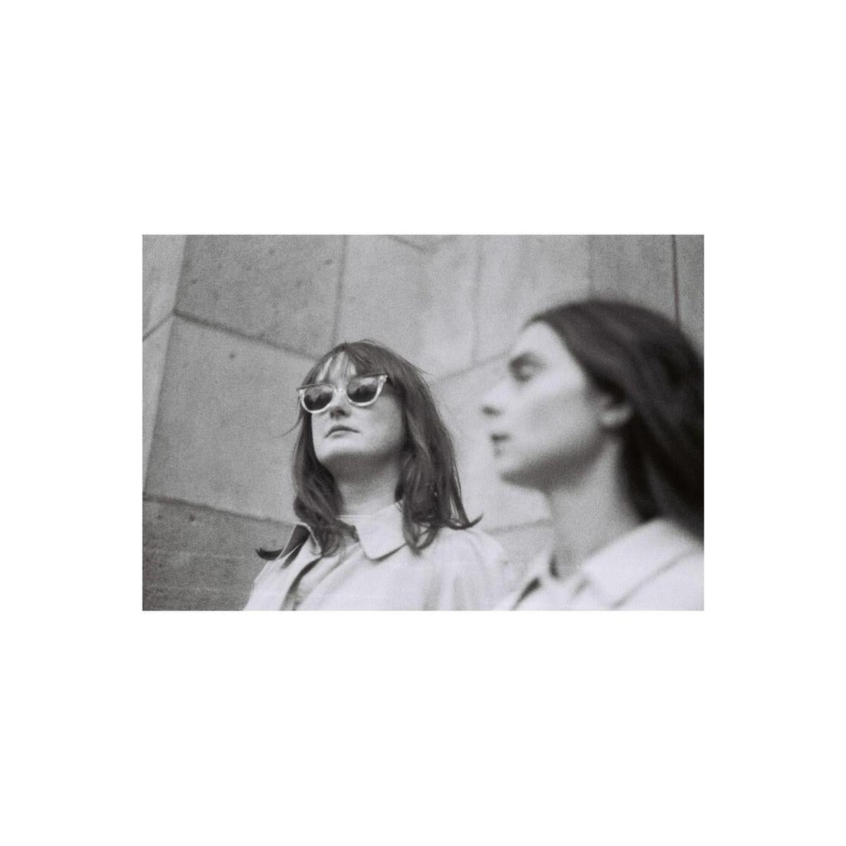 Two women in a high-contrast black and white film portrait shot on Lomography Berlin Kino 400 35mm film.