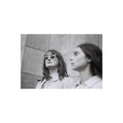 Two women in a high-contrast black and white film portrait shot on Lomography Berlin Kino 400 35mm film.